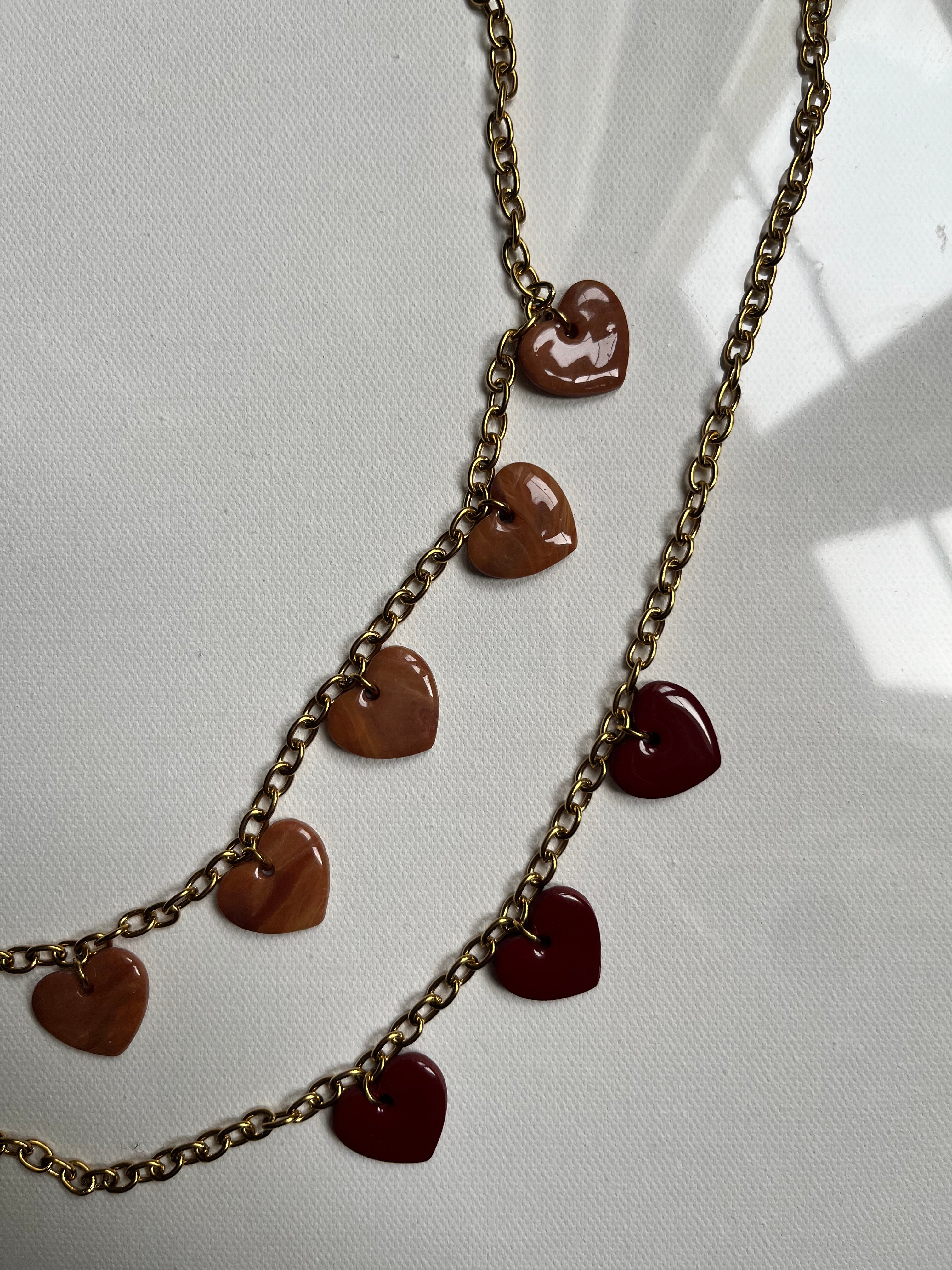 Collier 3 charms cœurs bordeaux